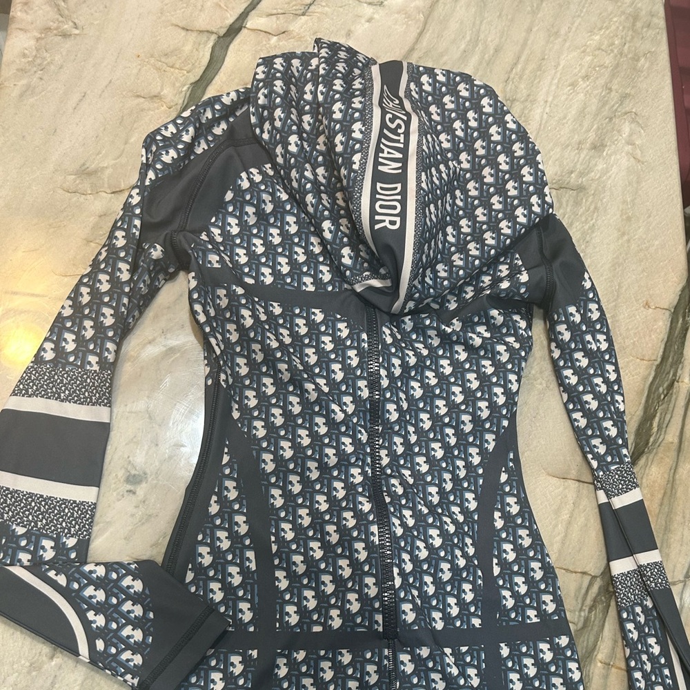 I have a one piece Dior body suit with long sleeves. WORN One Time!